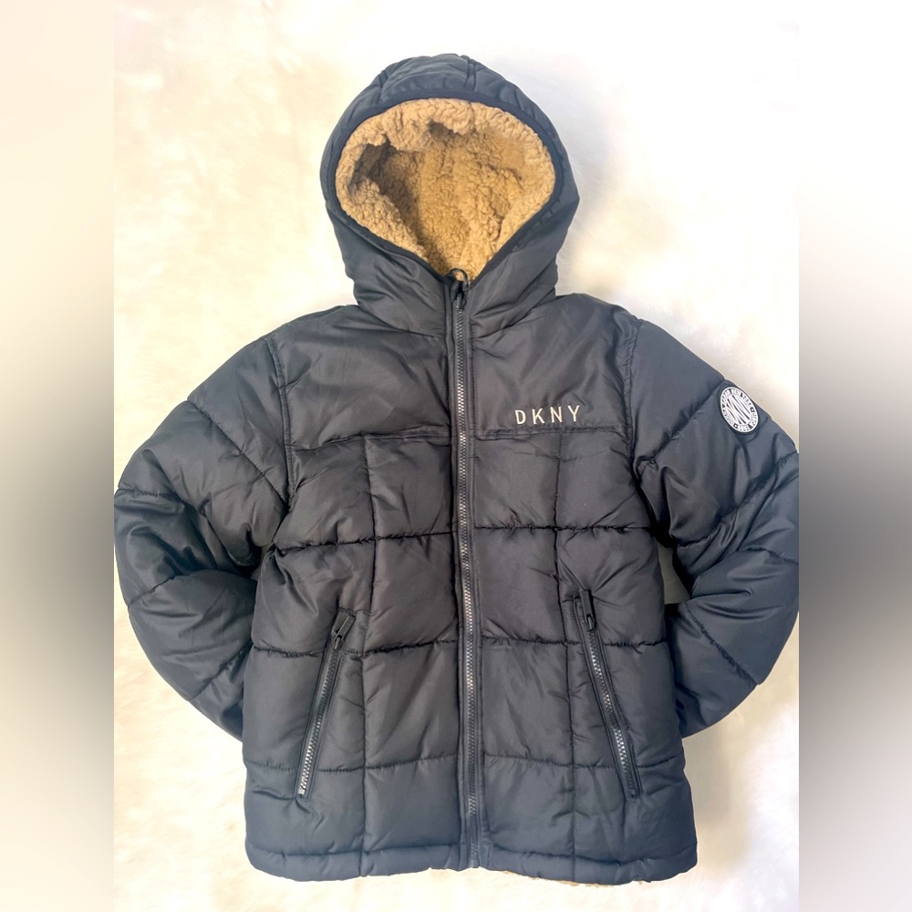 DKNY boys black reversible puffer jacket with tan Sherpa.